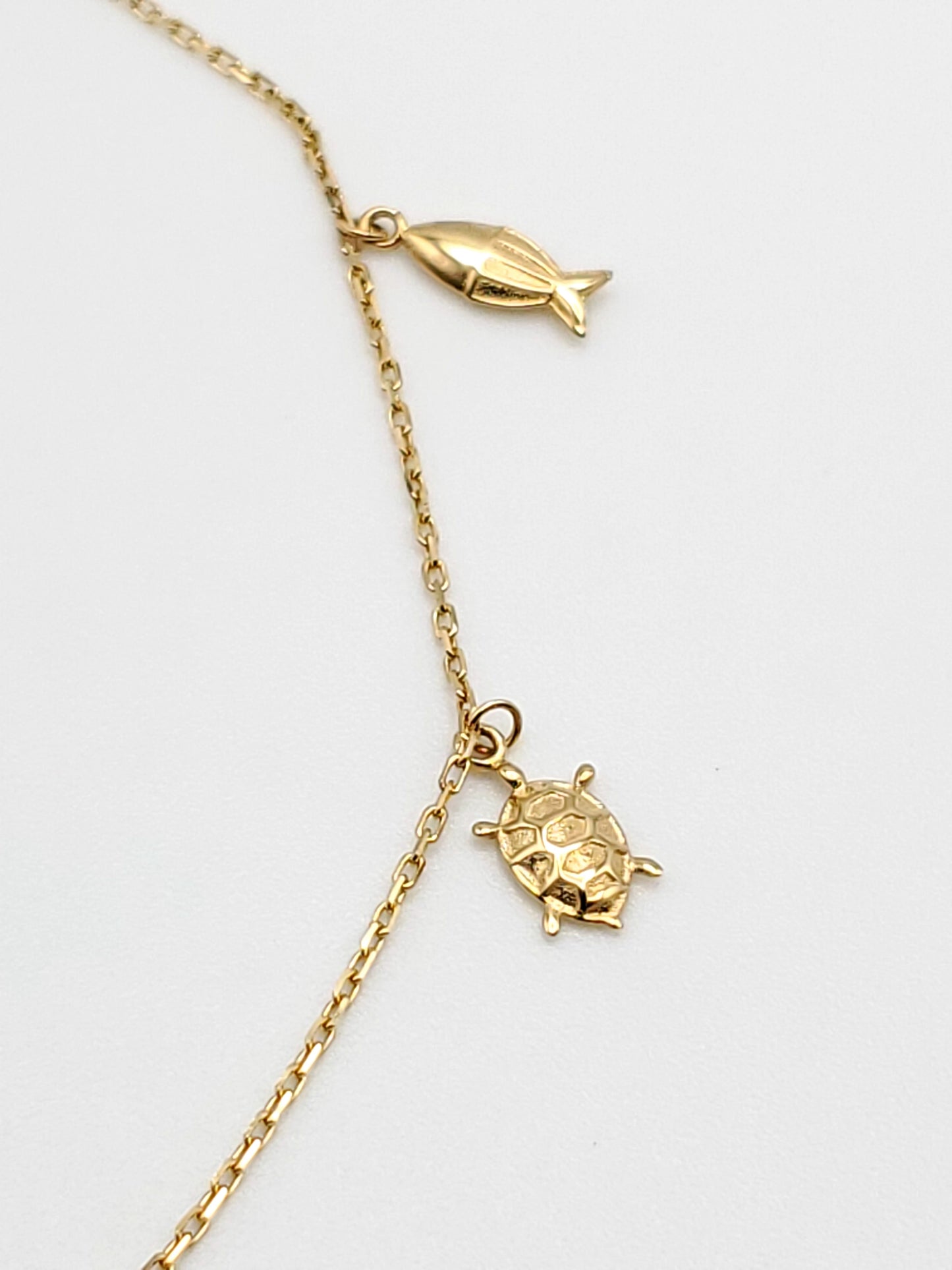 14k gold ocean themed charm bracelet