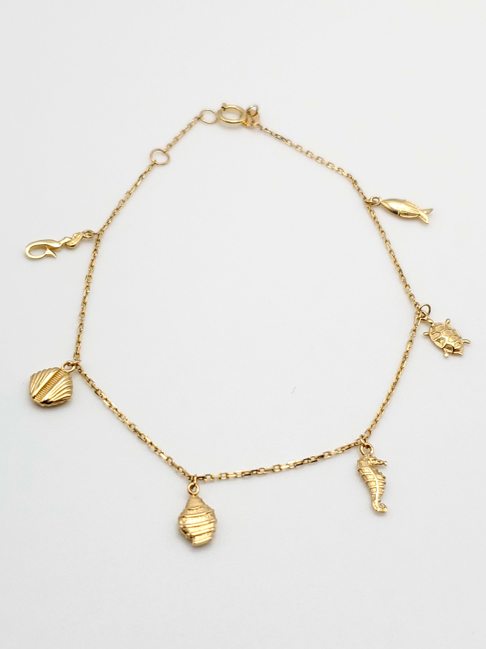 14k gold ocean themed charm bracelet